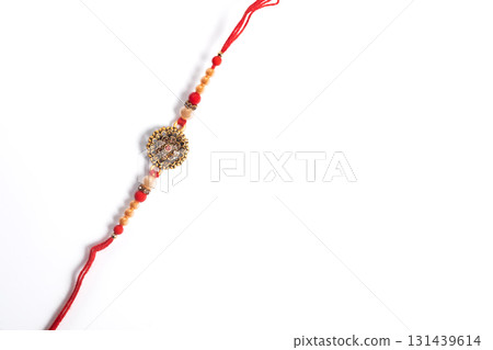 Traditional Rakhi bangle with colorful beads on a white background 131439614