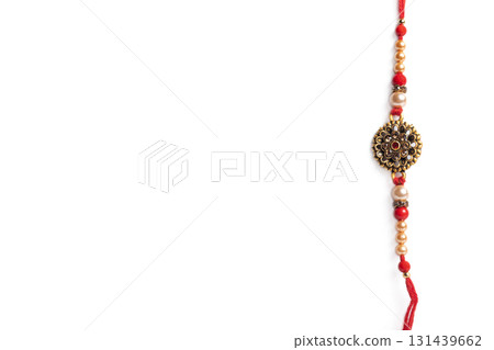 beautiful decorative thread bangle with a decorative design on a white background for Raksha Bandhan. 131439662