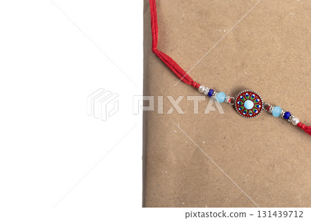 Colorful beaded bracelet with a round center pendant on a red cord Colorful beaded bracelet with a round center pendant on a red cord 131439712