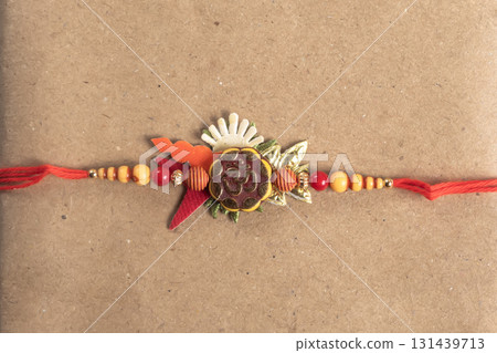 Rakhi bangle with Om beads and red string as a gift for Raksha Bandhan festival 131439713