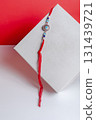 Traditional Rakhi bangle with bright red thread on a minimalist background 131439721