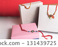 Elegant rakhi threads are displayed in gift boxes celebrating the festival of Raksha Bandhan. 131439725