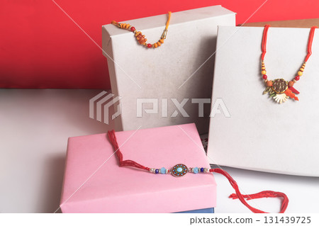 Elegant rakhi threads are displayed in gift boxes celebrating the festival of Raksha Bandhan. Elegant rakhi threads are displayed in gift boxes celebrating the festival of Raksha Bandhan. 131439725