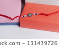Colorful Rakhi bangles in vibrant boxes celebrating the Indian festive bond. 131439726