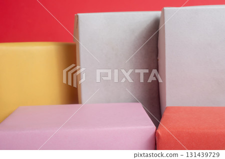 Colorful gift boxes wrapped in bright pastel paper for celebration and packaging Colorful gift boxes wrapped in bright pastel paper for celebration and packaging 131439729