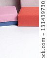 Colorful gift boxes with pink, orange and blue wrapping on a white surface for celebration and gifts. 131439730