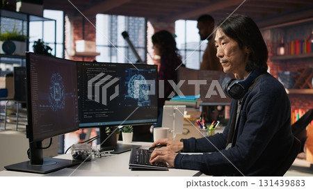 CTO manager in AI focused startup designing, coding and debugging applications in different software languages. Chief technician officer doing code testing and quality assurance, camera A CTO manager in AI focused startup designing, coding and debugging applications in different software languages. Chief technician officer doing code testing and quality assurance, camera A 131439883