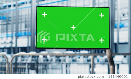 Green screen monitor in industry 4.0 industrial plant used to automate robotic machines. Chroma key display in smart factory used to oversee implementation of AI in facility equipment 131440001