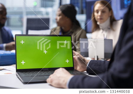 Investor in photovoltaics factory monitoring system performance on green screen laptop. Solar panels manufacturing plant executive using chroma key notebook to track energy production and efficiency Investor in photovoltaics factory monitoring system performance on green screen laptop. Solar panels manufacturing plant executive using chroma key notebook to track energy production and efficiency 131440038