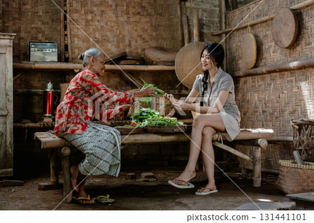 Generational Bond: Sharing Fresh Ingredients in a Rustic Kitchen Setting 131441101