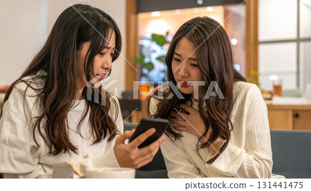 Japanese woman comforting her friend 131441475