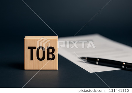 TOB lettered wooden block and contract background Tender offer concept 131441510