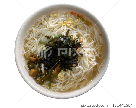 Comforting bowl of Korean noodle soup with egg seaweed and vegetables perfect for home meal Comforting bowl of Korean noodle soup with egg seaweed and vegetables perfect for home meal 131441594