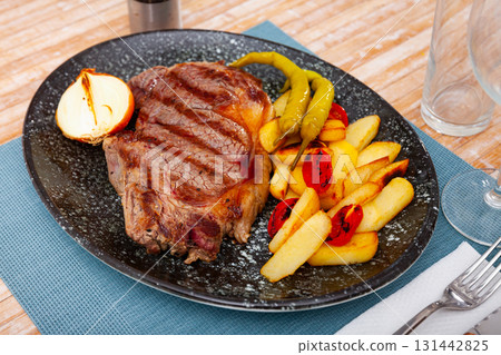 Tasty grilled beef with potato served Tasty grilled beef with potato served 131442825