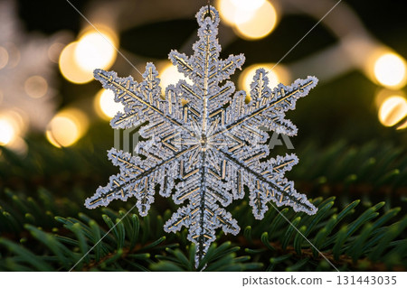 Glitter Snowflake Ornament Hanging On Christmas Tree 131443035