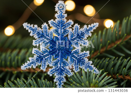Glitter Snowflake Ornament Hanging On Christmas Tree 131443036