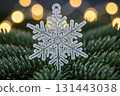 Glitter Snowflake Ornament Hanging On Christmas Tree 131443038