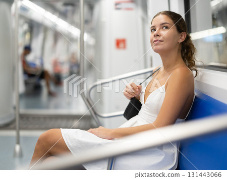 woman rides in a subway car woman rides in a subway car 131443066