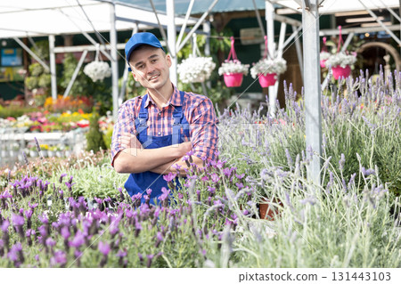Young male seller with lavender in store Young male seller with lavender in store 131443103