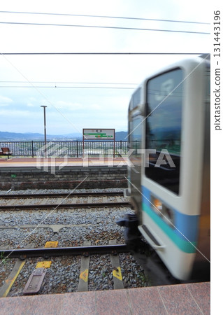 Local train at Obasute Station and Zenkoji Plain (JR Shinonoi Line) Local train at Obasute Station and Zenkoji Plain (JR Shinonoi Line) 131443196