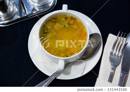 Appetizing soup with noodles and vegetables 131443580