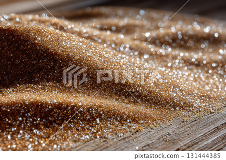 Sparkling brown sand captures sunlight on a wooden surface in the afternoon 131444385