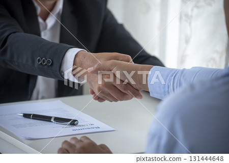 Close up hands Team Business Partners shaking hands together to Greeting Start up new project. Shakehand Teamwork Partnership office desk. Businessman partners handshake together. Business concept Close up hands Team Business Partners shaking hands together to Greeting Start up new project. Shakehand Teamwork Partnership office desk. Businessman partners handshake together. Business concept 131444648