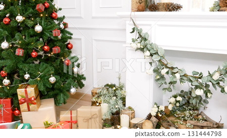 Christmas tree decorated holiday winter xmas celebration present gift to family decor bauble ornament golden ball in cozy living room. Merry Christmas and happy new year festival traditional concept 131444798