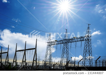 High voltage pole electric wiring distribution landscape energy engineering. Electricity energetic background with blue sky green mountain in countryside. Electric power energy engineering industrial 131444807
