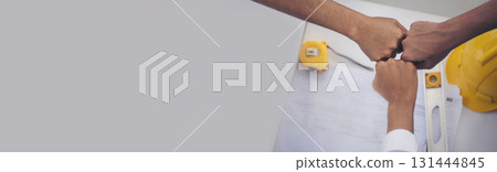 Banner Close up engineer men hands diversity multiethnic partners team together. Group of multiracial engineer Manager Foreman Teamwork meeting. Top view team join hands partnership with copy space 131444845
