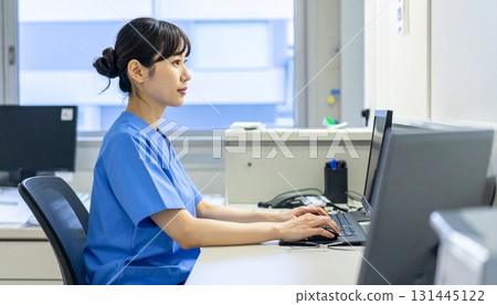 Nurses working at the hospital nurse station Nurses working at the hospital nurse station 131445122