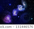The galaxy in the bluish purple clouds floating above the black background atmosphere 131446576