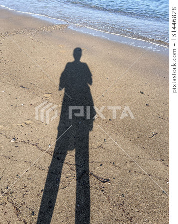 Human Shadow on Sandy Beach at Seaside, Summer Morning Light Concept Human Shadow on Sandy Beach at Seaside, Summer Morning Light Concept 131446828