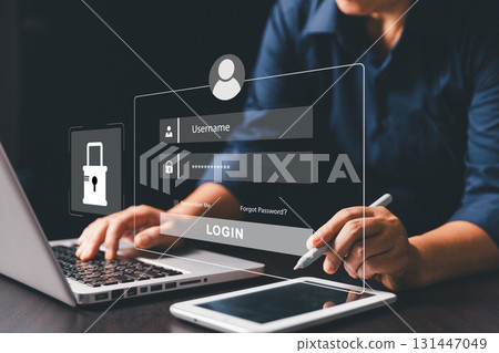 Businesswoman is securing laptops and protecting personal data through virtual interfaces, preventing online theft by applying key cybersecurity. UX design, mobile apps, User login interface concept. Businesswoman is securing laptops and protecting personal data through virtual interfaces, preventing online theft by applying key cybersecurity. UX design, mobile apps, User login interface concept. 131447049