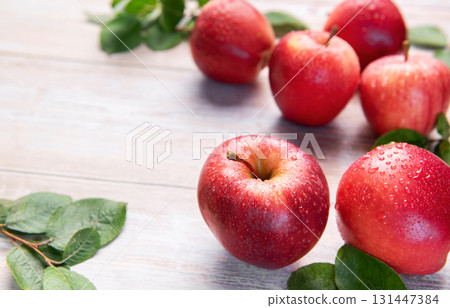Fresh red gala apples with green leaves Fresh red gala apples with green leaves 131447384