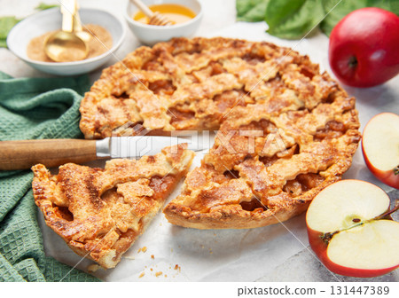 Homemade apple pie with ingredients on concrete background 131447389