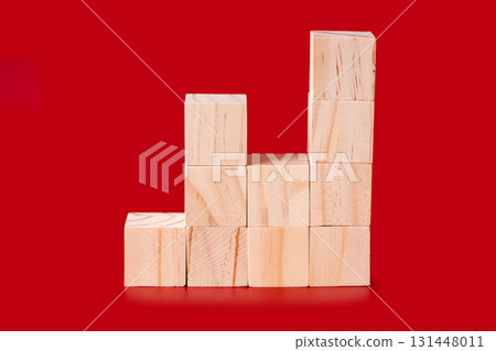 Wooden cubes on red 131448011
