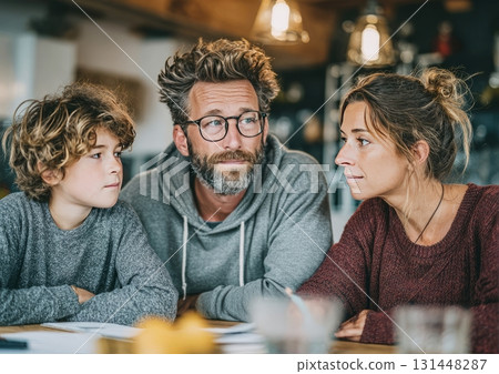 Family discussing serious topic at home table Family discussing serious topic at home table 131448287