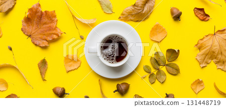 Flat lay composition with colorful Autumn cup of coffee and leaves on a color background. top view 131448719