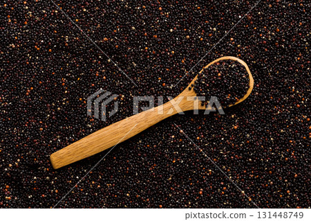 black quinoa grain in wooden spoon background and texture of gluten free top view black quinoa grain in wooden spoon background and texture of gluten free top view 131448749