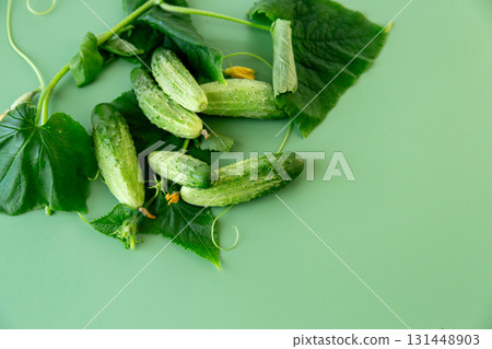 Healthy cucumbers with green tops are ideal for a diet menu Healthy cucumbers with green tops are ideal for a diet menu 131448903