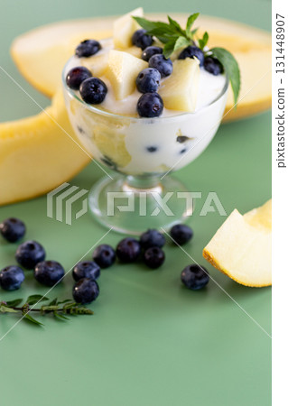 Summer vitamin cream yogurt with melon blueberries and mint Summer vitamin cream yogurt with melon blueberries and mint 131448907