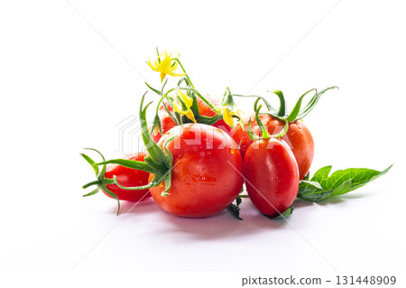 Ripe red tomatoes with flowers isolated on white background Ripe red tomatoes with flowers isolated on white background 131448909