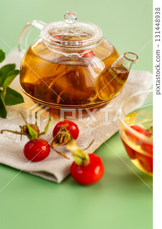 Medicinal rosehip tea with flowers and berries 131448938