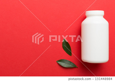 supplement pills with medicine bottle health care and medical top view. Vitamin tablets. Top view mockup bottle for pills and vitamins with green leaves, natural organic bio supplement, copy space supplement pills with medicine bottle health care and medical top view. Vitamin tablets. Top view mockup bottle for pills and vitamins with green leaves, natural organic bio supplement, copy space 131448984
