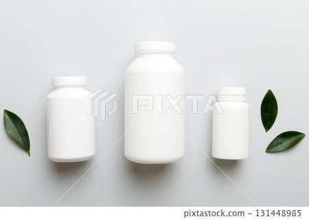 supplement pills with medicine bottle health care and medical top view. Vitamin tablets. Top view mockup bottle for pills and vitamins with green leaves, natural organic bio supplement, copy space supplement pills with medicine bottle health care and medical top view. Vitamin tablets. Top view mockup bottle for pills and vitamins with green leaves, natural organic bio supplement, copy space 131448985