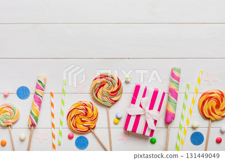 Collection of birthday party objects with gift box. Valentines day gift box. Top view flat lay with copy space Collection of birthday party objects with gift box. Valentines day gift box. Top view flat lay with copy space 131449049