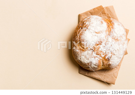 Fresh homemade crisp round bread on napkin, top view. Healthy unleavened bread. French bread. Top view Bakery products 131449129