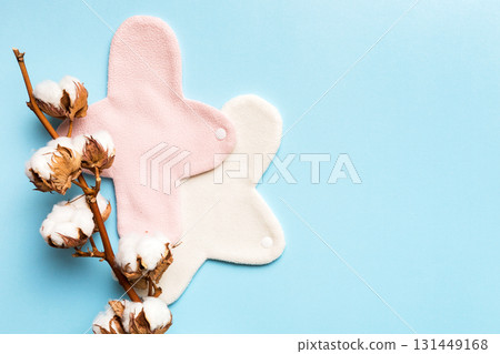 set of colorful bright reusable menstrual pads with cotton flower. zero waste woman periods concept top view with copy space 131449168