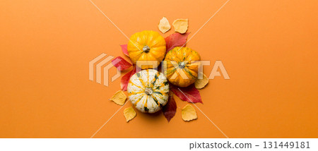 Autumn composition. Pattern made of dried leaves and other design accessories on table. Flat lay, top view Autumn composition. Pattern made of dried leaves and other design accessories on table. Flat lay, top view 131449181